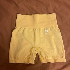 Gymshark shorts size Small in bright orange/yellow color